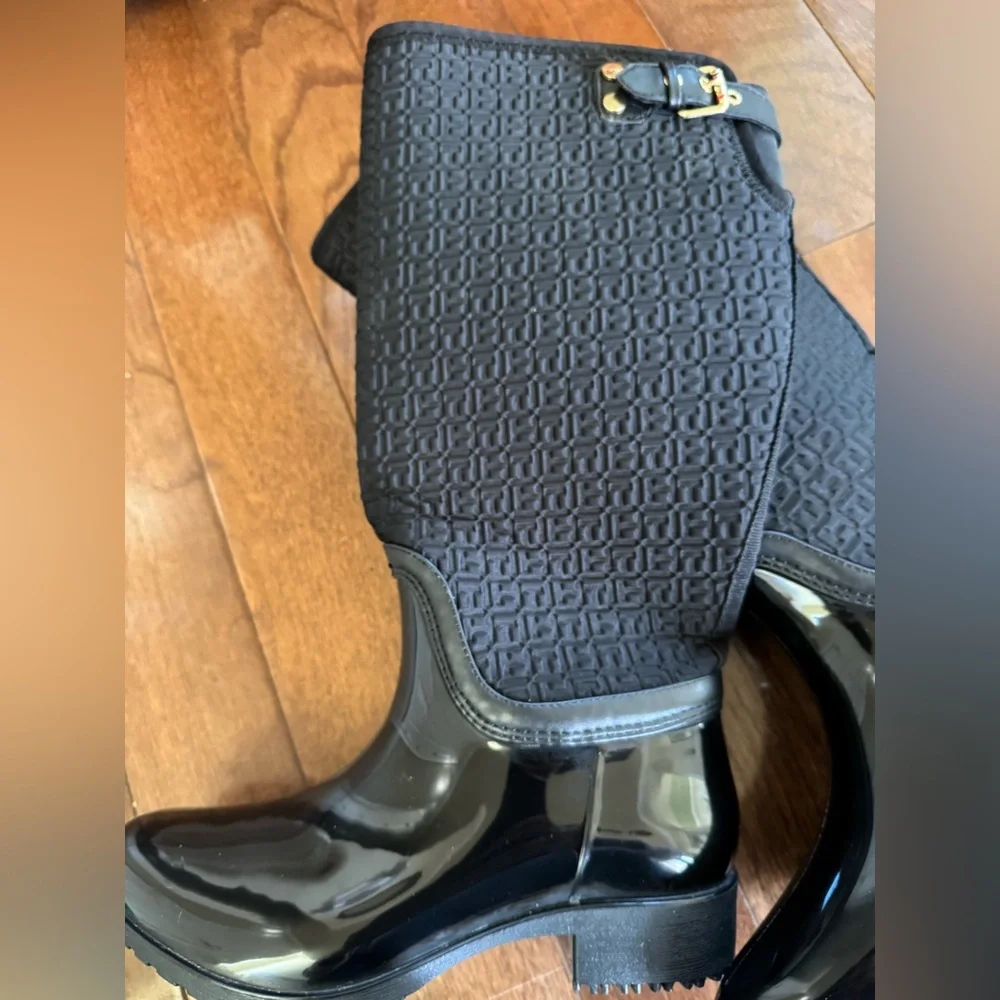 Tommy Hilfiger Black Boots. Gold accent hardware, logo embossed fabric.